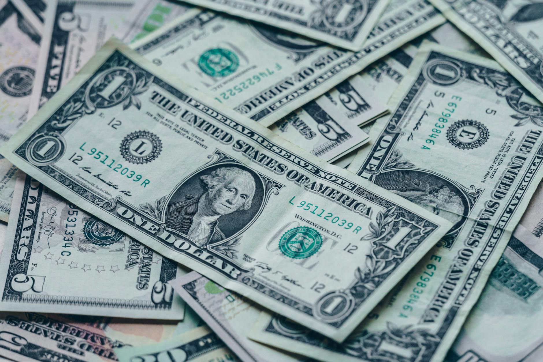 photography of one us dollar banknotes