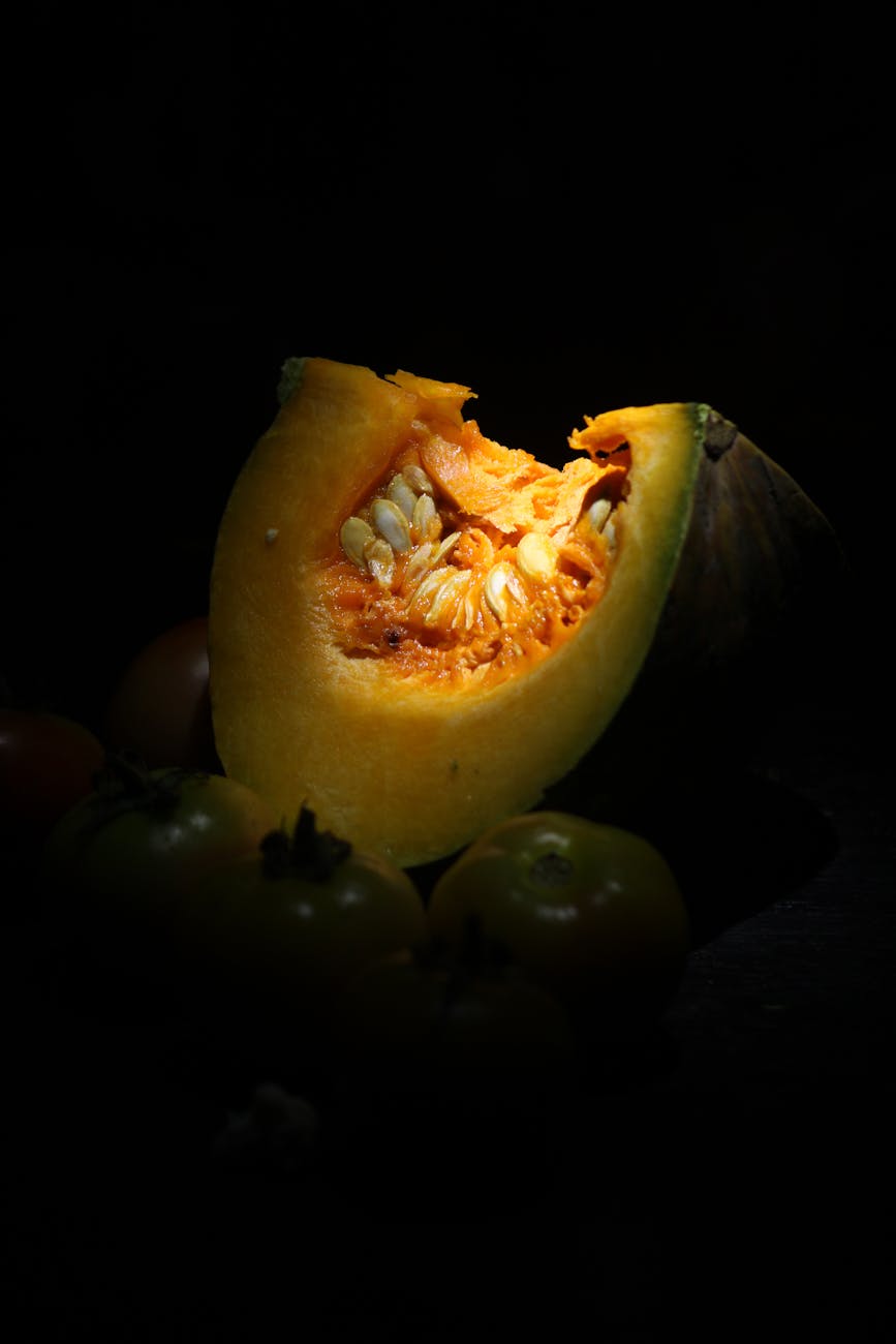 close up of pumpkin slice in dramatic lighting