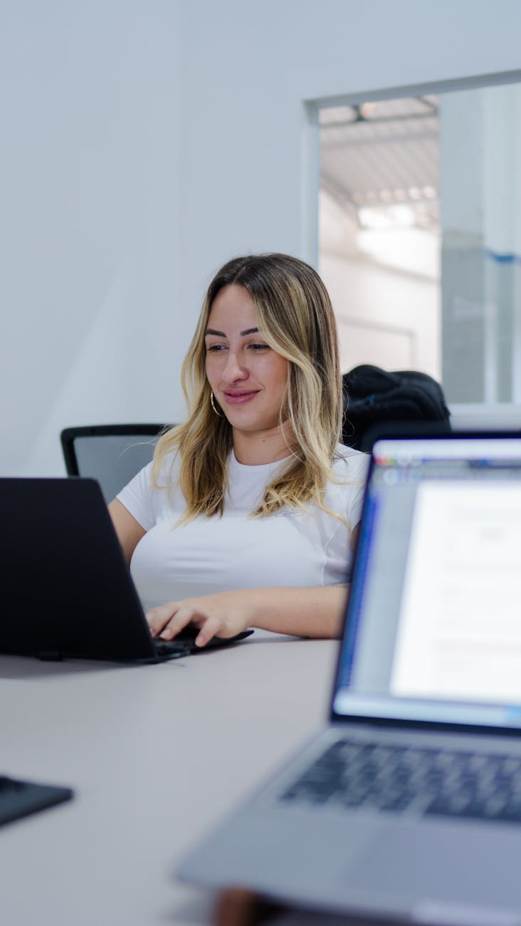 woman working on laptop in modern office