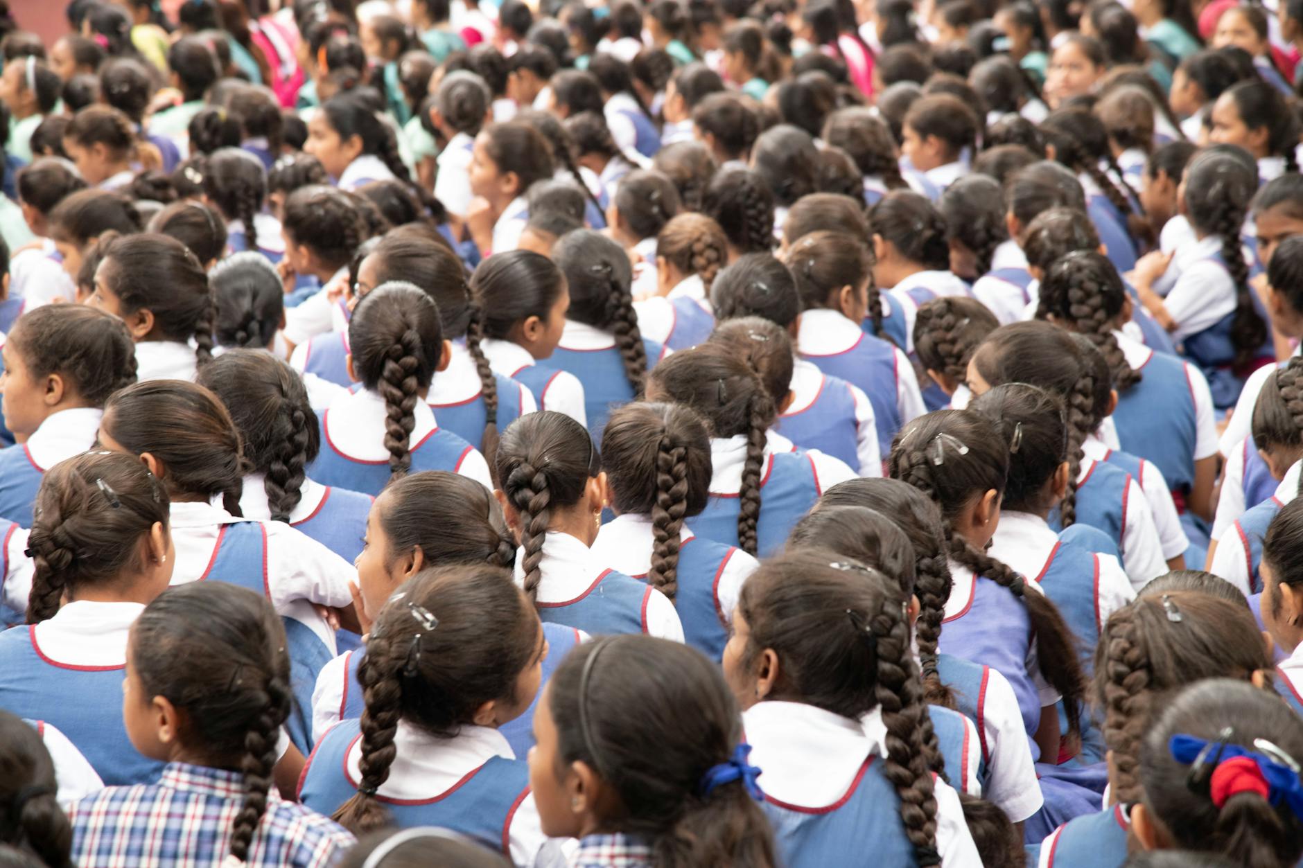women wearing blue and white uniform