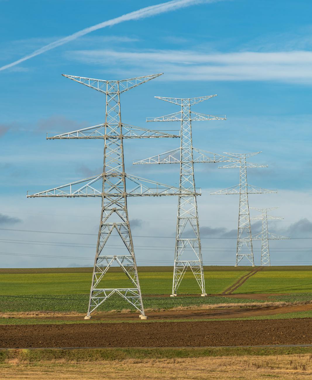 electricity poles on a field